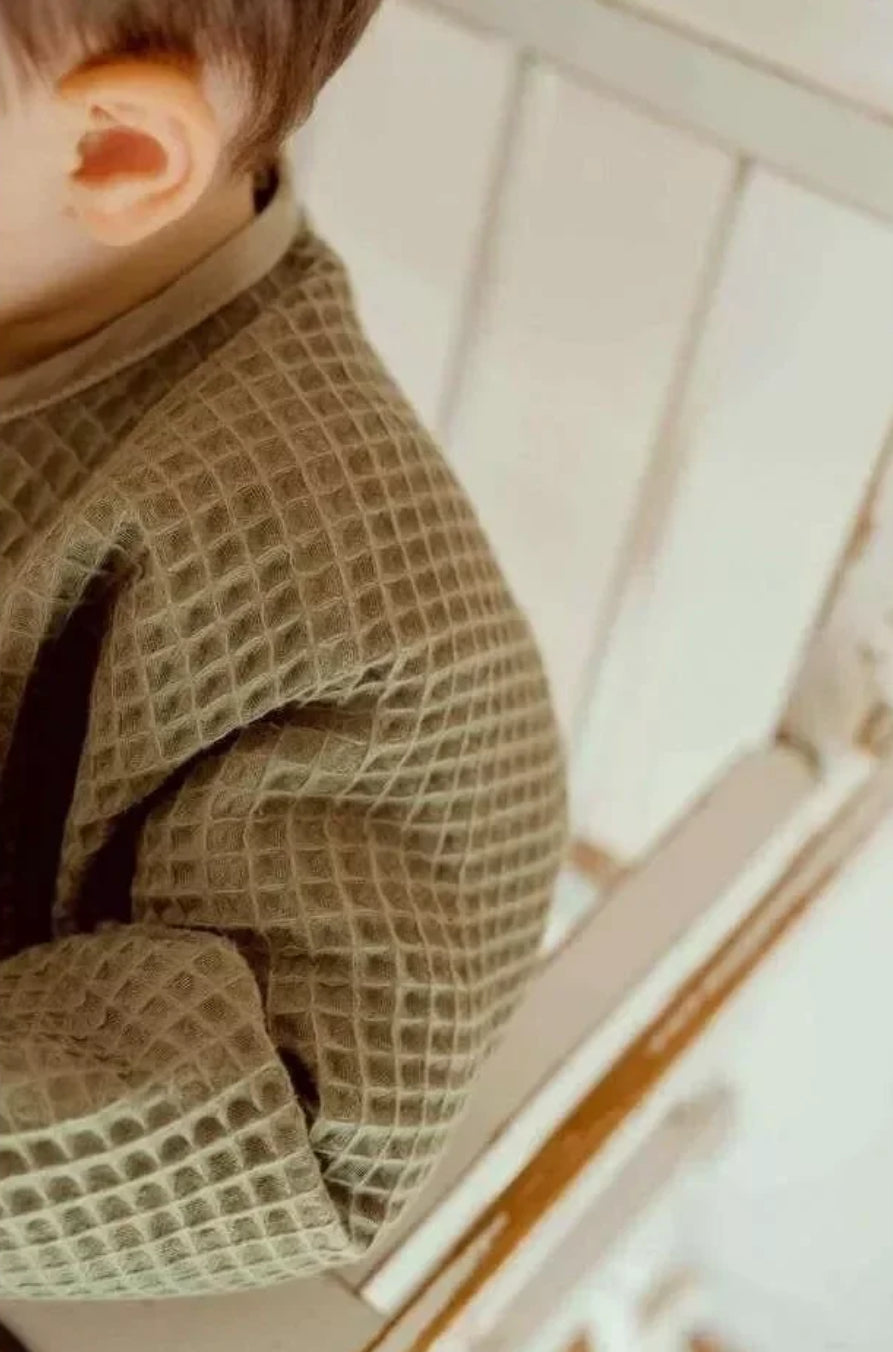 Bavoir à manches nid d'abeille - KAKI BB Cigogne